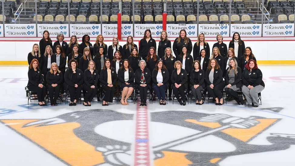 Amy Wesson, SMBA '17 with the women of the Penguins organization.