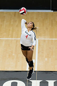 SDSU volleyball player, Lauren Lee, serves to the opposing team