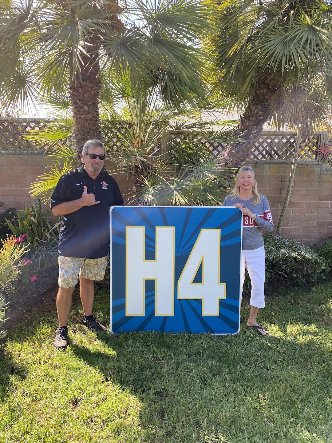 John and Billie McAvoy with one of the H4 signs. 