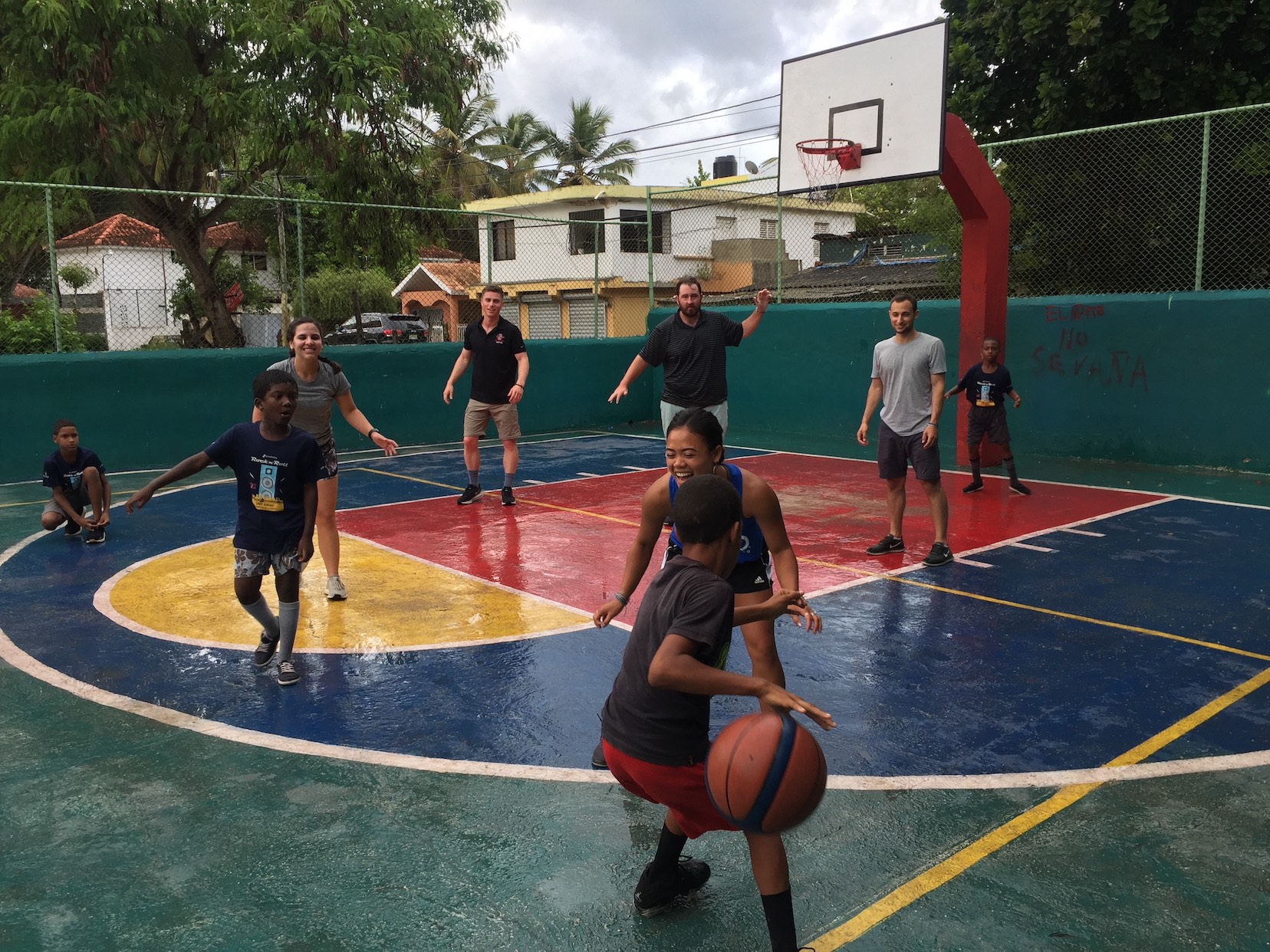 SMBA '20 plays basketball with Domincan Republic youth while on their international trip. 