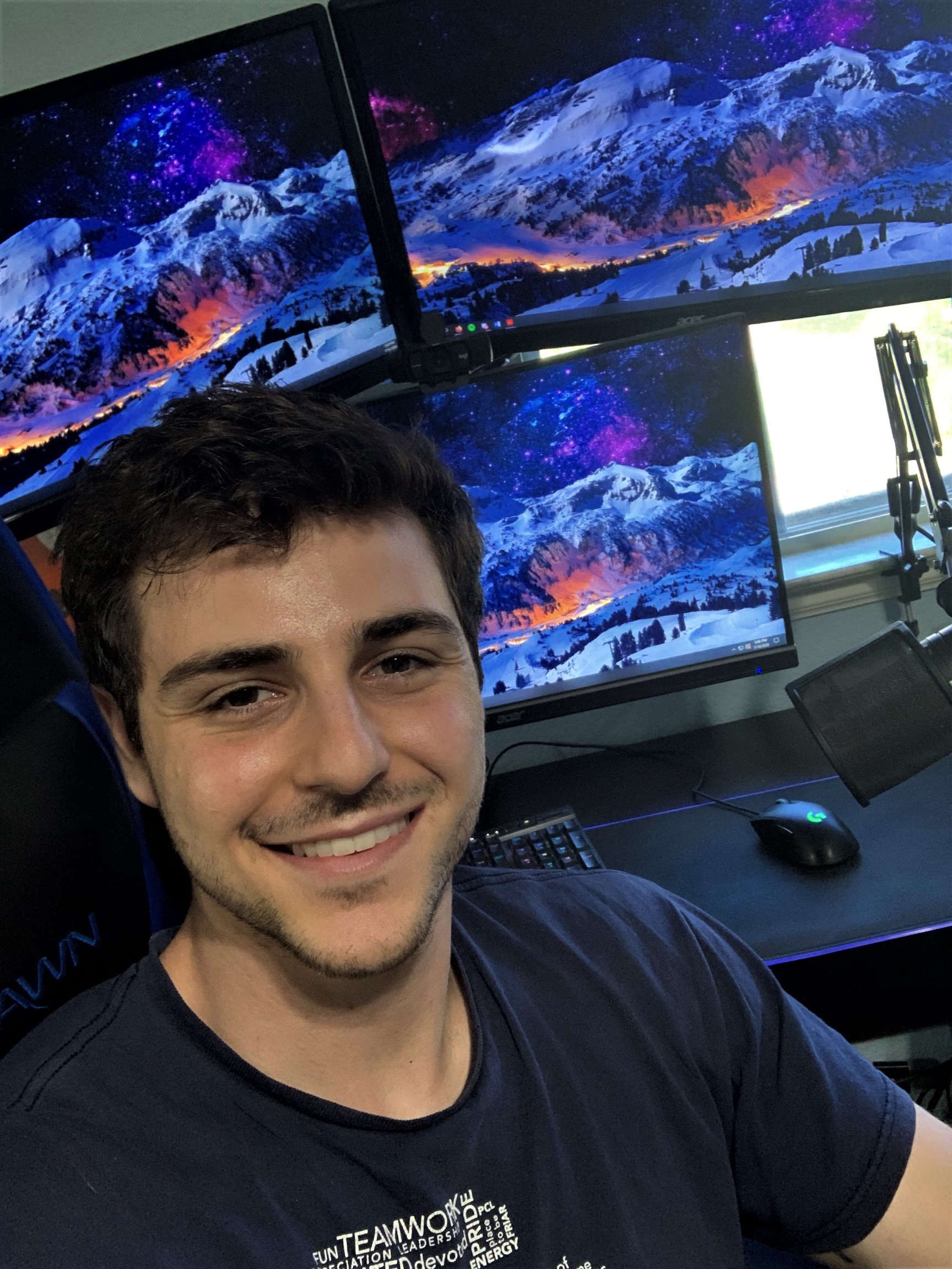 Sam Litrenta at his home office with his custom PC set-up that he built and installed himself. He uses this set-up to analyze stock charts and trade stocks/options.