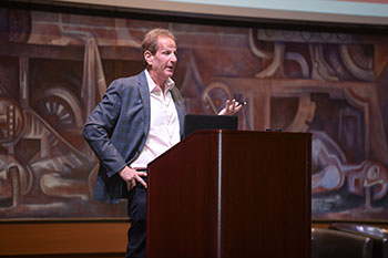 Steven Oskinski at the podium during the 2020 Women in Entrepreneurship and Leadership event.