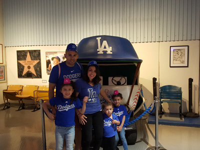 Walter poses with his family at a Dodger game.