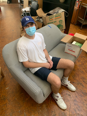Jackson Novak takes a break from his work in the Humble Design warehouse
