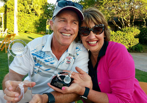 Alison Fleury and her husband, Randy, show off the golf trophies they won at the Grossmont Hospital Foundation Golf Tournament in 2017  