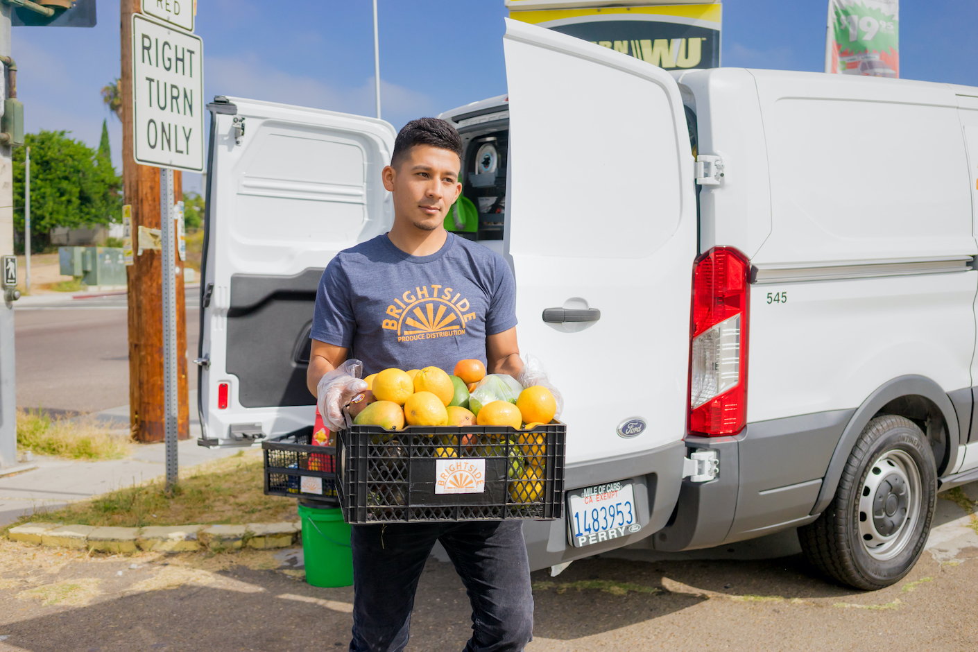 An SDSU Student delivers produce to a local market for the Brightside Produce Progam