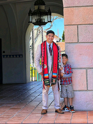 Torres and his son on graduation day.