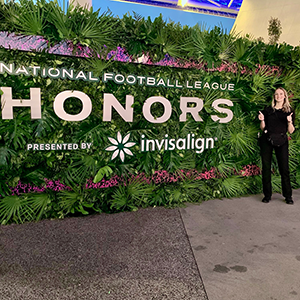 SMBA '22 Candidate Laurel Smith standing in front of the NFL Honors sign