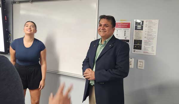 Professor Anurag Mehrotra chats with his students prior to class (courtesy SDSU)