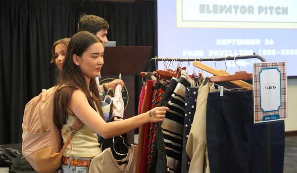SDSU Fowler students shop for donated professional clothing at the Executive's Closet event